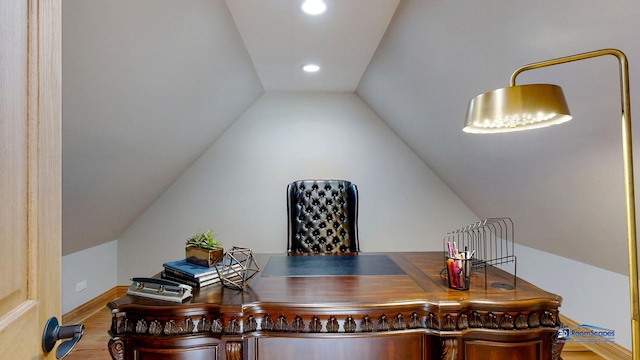 19113 Lauren Ln, Marengo, IL 60152 - home office with lofted ceiling, wood finished floors, and recessed lighting