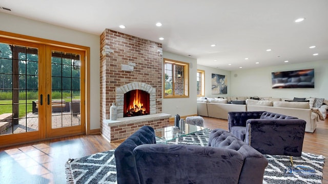 19113 Lauren Ln, Marengo, IL 60152 - living area featuring french doors, recessed lighting, wood finished floors, and a fireplace