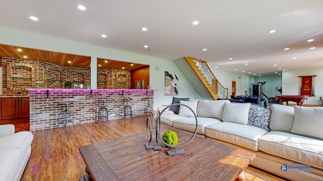 19113 Lauren Ln, Marengo, IL 60152 - living room with a bar, wood finished floors, billiards table, recessed lighting, and stairway