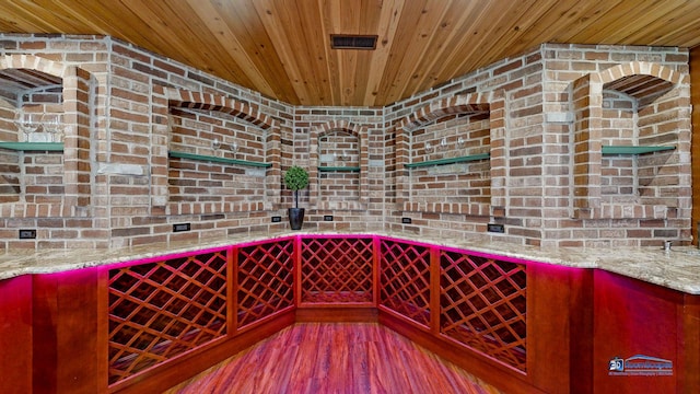 19113 Lauren Ln, Marengo, IL 60152 - wine cellar featuring wood ceiling, brick wall, and wood finished floors