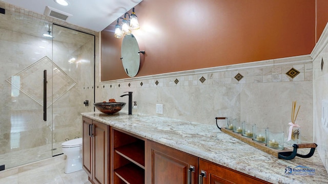 19113 Lauren Ln, Marengo, IL 60152 - full bath with vanity, a shower stall, tile walls, and tile patterned flooring