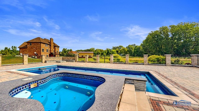 19113 Lauren Ln, Marengo, IL 60152 - view of swimming pool with an in-ground hot tub and a patio area
