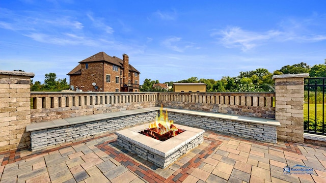 19113 Lauren Ln, Marengo, IL 60152 - view of patio featuring an outdoor fire pit