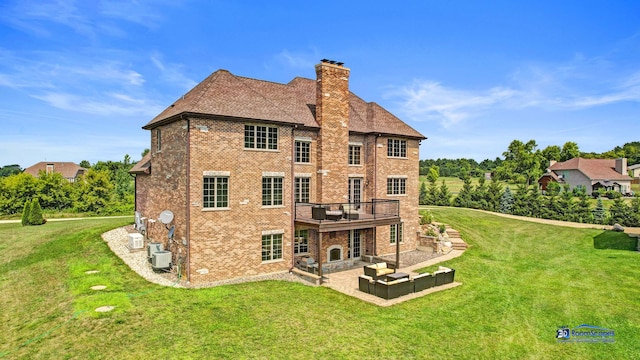 19113 Lauren Ln, Marengo, IL 60152 - rear view of house featuring a chimney, a patio, a yard, brick siding, and a wooden deck