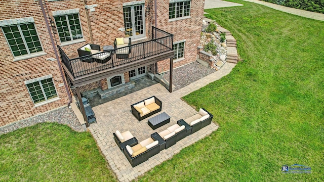 19113 Lauren Ln, Marengo, IL 60152 - rear view of house featuring outdoor lounge area, a patio, and a lawn