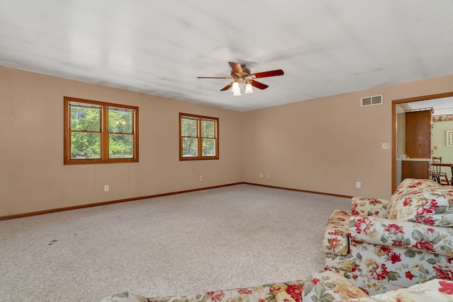 955 E 5th St, Coal City, IL 60416 - unfurnished living room with a ceiling fan and carpet