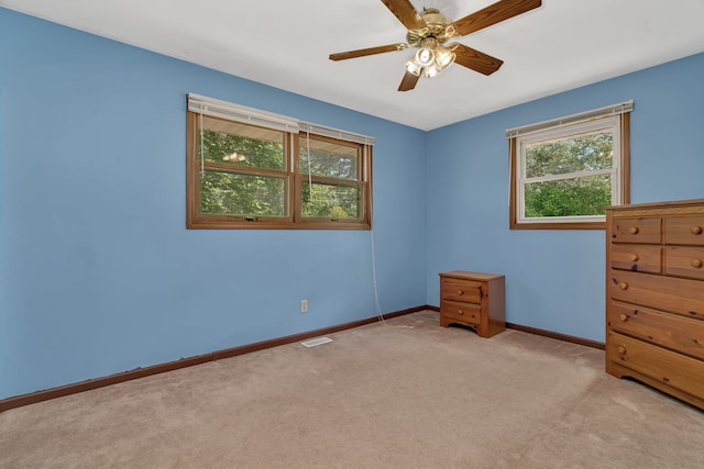 955 E 5th St, Coal City, IL 60416 - unfurnished bedroom with light carpet and a ceiling fan