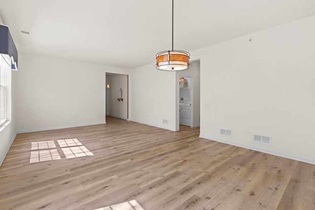 14300 Sundance Dr, Huntley, IL 60142 - unfurnished room featuring light wood finished floors and washer / clothes dryer