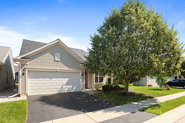 14300 Sundance Dr, Huntley, IL 60142 - view of front of property with driveway, a garage, a front yard, and a shingled roof