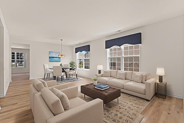 14300 Sundance Dr, Huntley, IL 60142 - living area with light wood-style flooring and baseboards
