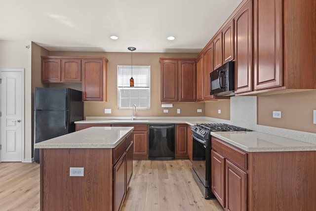 14300 Sundance Dr, Huntley, IL 60142 - kitchen with black appliances, light wood finished floors, decorative light fixtures, a kitchen island, and recessed lighting