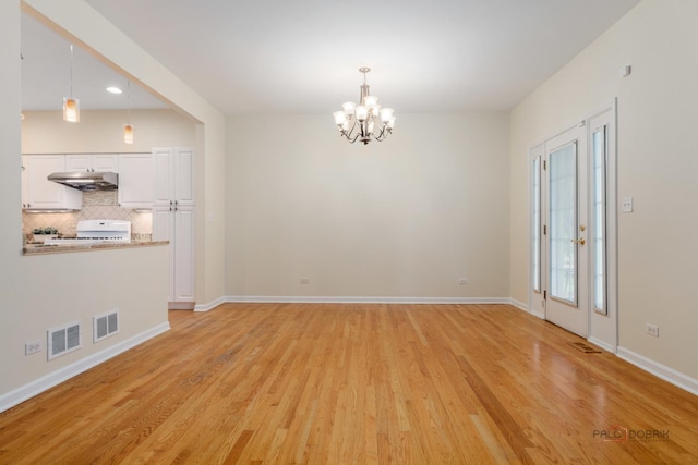 1804 Monroe Ct, Glenview, IL 60025 - spare room with a chandelier, light wood-style flooring, and recessed lighting