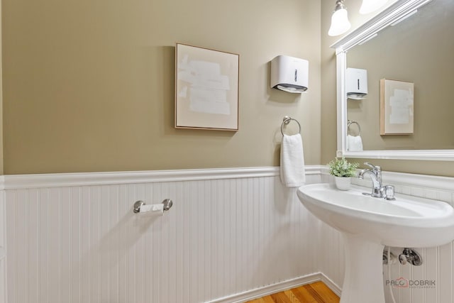 1804 Monroe Ct, Glenview, IL 60025 - bathroom featuring wainscoting and a sink