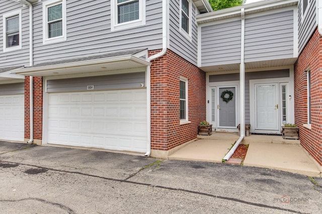 1804 Monroe Ct, Glenview, IL 60025 - property entrance featuring brick siding and an attached garage