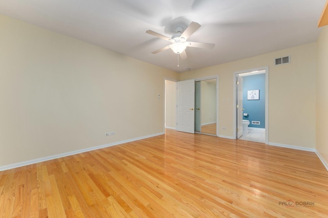 1804 Monroe Ct, Glenview, IL 60025 - unfurnished bedroom with light wood-style flooring, connected bathroom, and ceiling fan