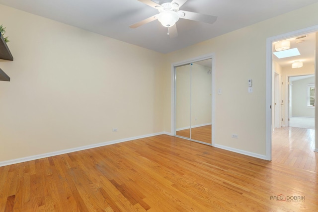 1804 Monroe Ct, Glenview, IL 60025 - unfurnished bedroom with light wood-type flooring, a closet, and ceiling fan