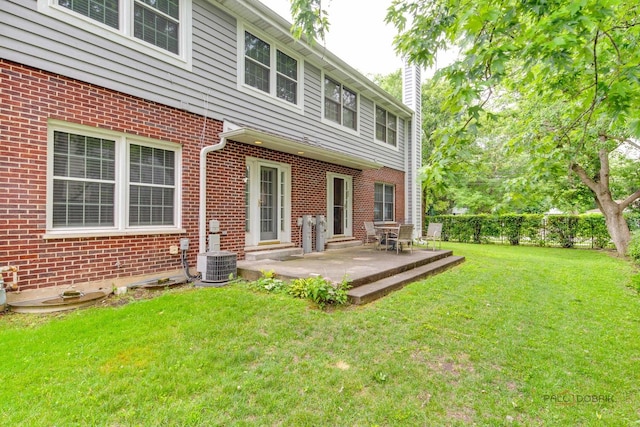 1804 Monroe Ct, Glenview, IL 60025 - rear view of house featuring a chimney, brick siding, and a patio area