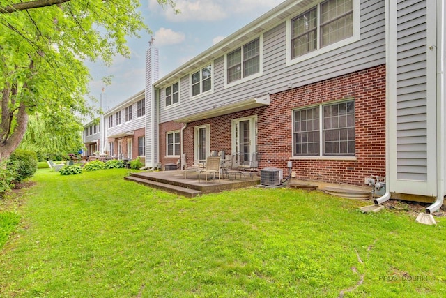 1804 Monroe Ct, Glenview, IL 60025 - back of house with brick siding, a chimney, a yard, and a patio area
