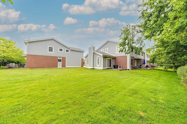 1804 Monroe Ct, Glenview, IL 60025 - rear view of property featuring brick siding and a yard