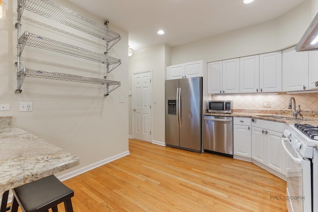 1804 Monroe Ct, Glenview, IL 60025 - kitchen featuring appliances with stainless steel finishes, white cabinets, decorative backsplash, and recessed lighting