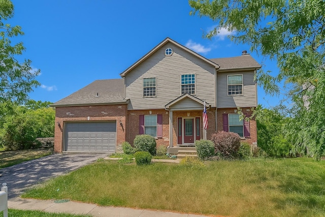 38422 N Adams St, Lake Villa, IL 60046 - view of front of property with driveway, a garage, brick siding, and a front yard