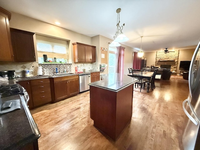 38422 N Adams St, Lake Villa, IL 60046 - kitchen featuring dishwasher, a kitchen island, backsplash, and light wood finished floors