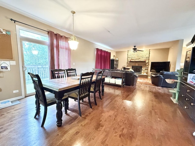 38422 N Adams St, Lake Villa, IL 60046 - dining area with wood finished floors, ceiling fan, and a stone fireplace