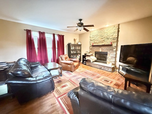 38422 N Adams St, Lake Villa, IL 60046 - living area featuring a ceiling fan, wood finished floors, and a stone fireplace