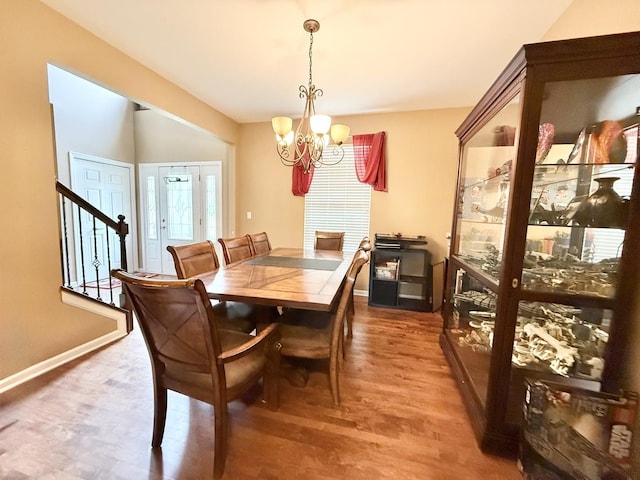 38422 N Adams St, Lake Villa, IL 60046 - dining area with a chandelier, stairway, and wood finished floors