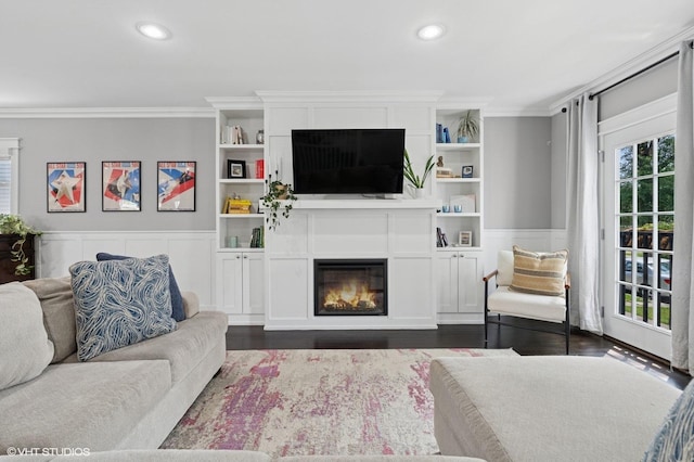 5106 W Eddy St, Chicago, IL 60641 - living area featuring crown molding, a glass covered fireplace, recessed lighting, wainscoting, and dark wood finished floors