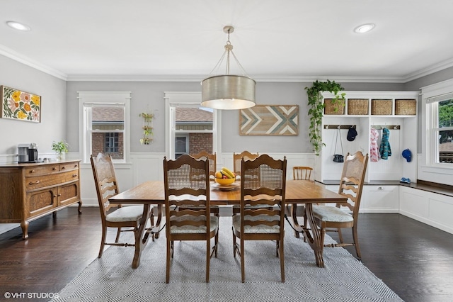 5106 W Eddy St, Chicago, IL 60641 - dining area featuring crown molding, dark wood-type flooring, wainscoting, recessed lighting, and a decorative wall