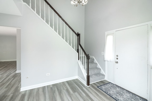 1557 Scottdale Cir, Wheaton, IL 60189 - entrance foyer with wood finished floors, stairs, a chandelier, and a towering ceiling