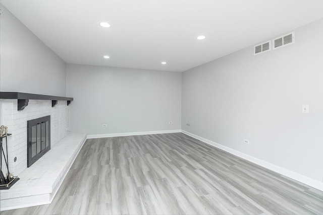 1557 Scottdale Cir, Wheaton, IL 60189 - unfurnished living room with light wood-type flooring, recessed lighting, and a fireplace
