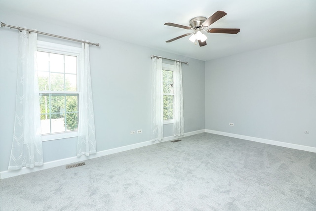 1557 Scottdale Cir, Wheaton, IL 60189 - spare room featuring carpet, healthy amount of natural light, and ceiling fan
