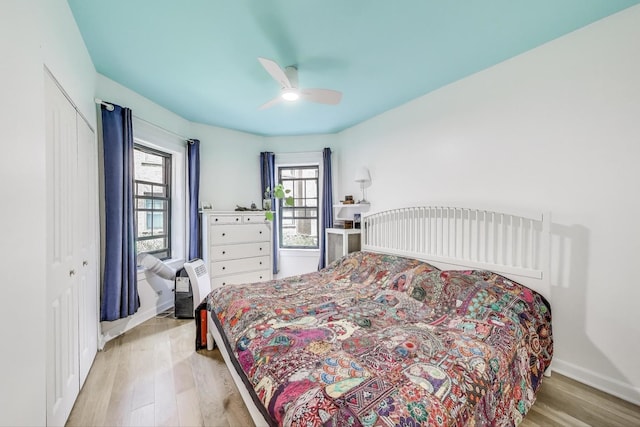 7021 N Sheridan Rd Unit 1, Chicago, IL 60626 - bedroom featuring light wood-type flooring, a closet, and ceiling fan