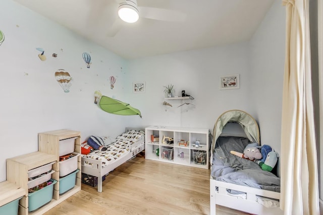 7021 N Sheridan Rd Unit 1, Chicago, IL 60626 - bedroom with wood finished floors and a ceiling fan