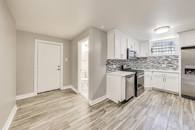 7021 N Sheridan Rd Unit 1, Chicago, IL 60626 - kitchen featuring stainless steel appliances, light countertops, light wood finished floors, and decorative backsplash