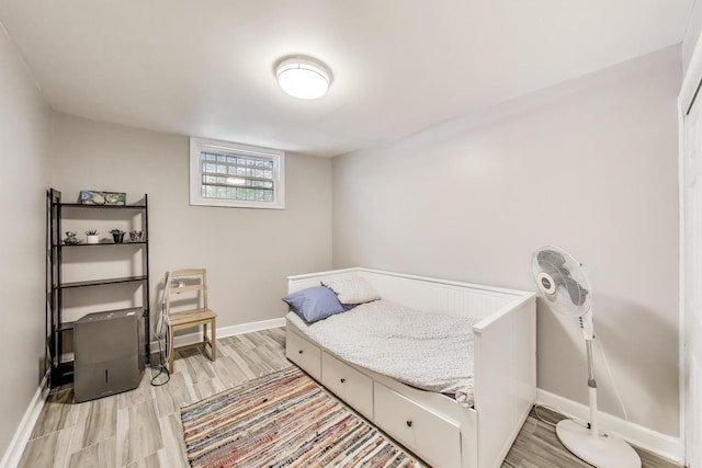 7021 N Sheridan Rd Unit 1, Chicago, IL 60626 - bedroom with baseboards and light wood-style flooring