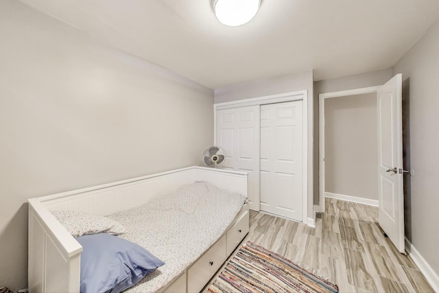 7021 N Sheridan Rd Unit 1, Chicago, IL 60626 - unfurnished bedroom with a closet and light wood-style floors