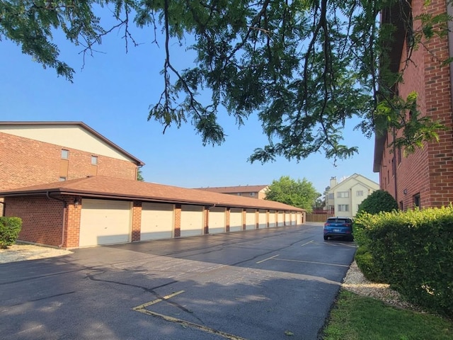 11009 Stony Creek Dr Unit 1C, Palos Hills, IL 60465 - view of asphalt road featuring community garages
