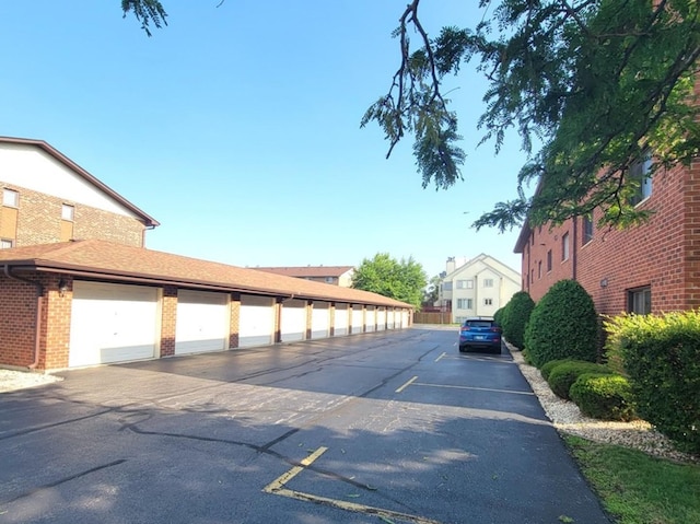 11009 Stony Creek Dr Unit 1C, Palos Hills, IL 60465 - view of asphalt road featuring community garages