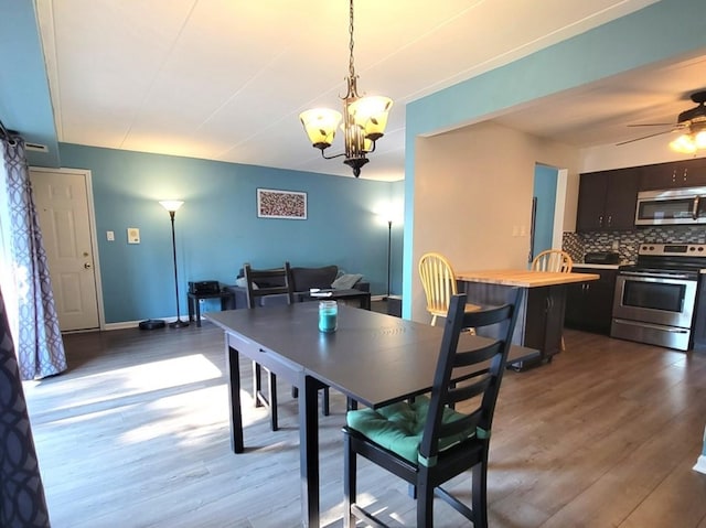 11009 Stony Creek Dr Unit 1C, Palos Hills, IL 60465 - dining space with wood finished floors, a chandelier, and ceiling fan