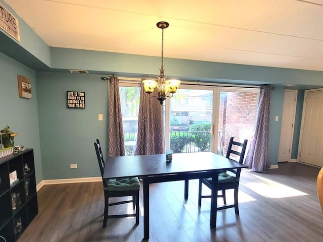 11009 Stony Creek Dr Unit 1C, Palos Hills, IL 60465 - dining space featuring a chandelier and wood finished floors