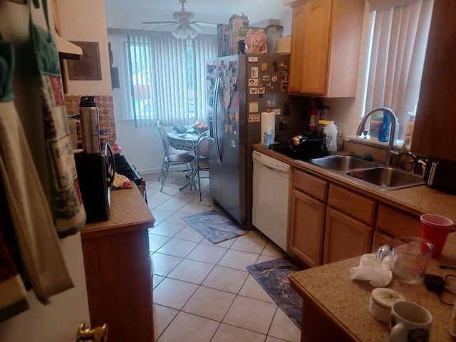 8506 S Jeffery Blvd, Chicago, IL 60617 - kitchen featuring dishwasher, light tile patterned floors, ceiling fan, and light countertops