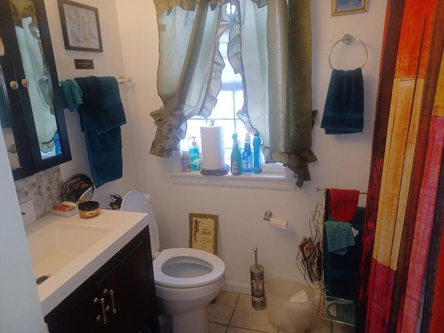 8506 S Jeffery Blvd, Chicago, IL 60617 - bathroom with vanity, backsplash, and tile patterned floors