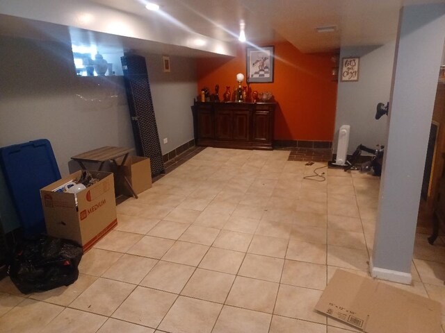 8506 S Jeffery Blvd, Chicago, IL 60617 - finished below grade area featuring light tile patterned floors and bar area