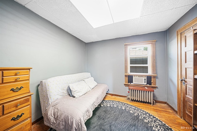 15429 Lamon Ave, Oak Forest, IL 60452 - living area featuring radiator heating unit, cooling unit, and wood finished floors
