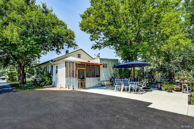 15429 Lamon Ave, Oak Forest, IL 60452 - view of patio with a sunroom and outdoor dining area