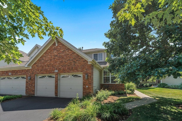 270 Birch Ln, Saint Charles, IL 60175 - view of front of property with brick siding, a garage, driveway, a front yard, and roof with shingles
