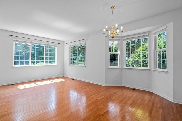 270 Birch Ln, Saint Charles, IL 60175 - spare room with a chandelier and hardwood / wood-style floors
